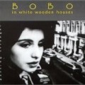 Bobo in white wooden Houses - Passing Stranger